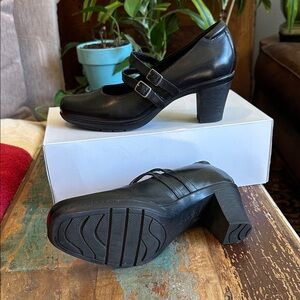 Clark’s black leather heels.